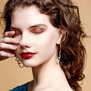 Artsy Gold Tone Face Stud Earrings