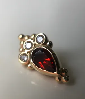 BVLA - Pear Sarai featuring Garnet pear(AA) with white diamonds ( VS) accents in solid yellow gold.