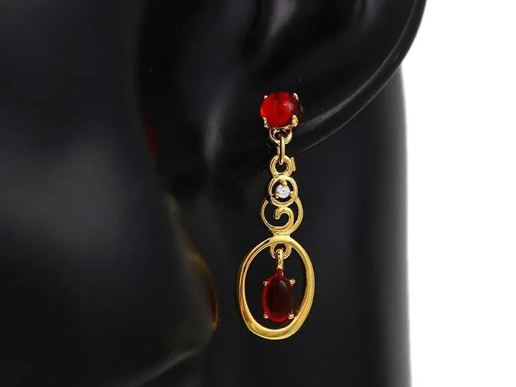 Fashionable long earrings with red ruby stones