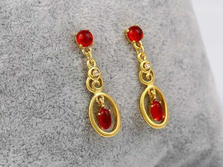 Fashionable long earrings with red ruby stones