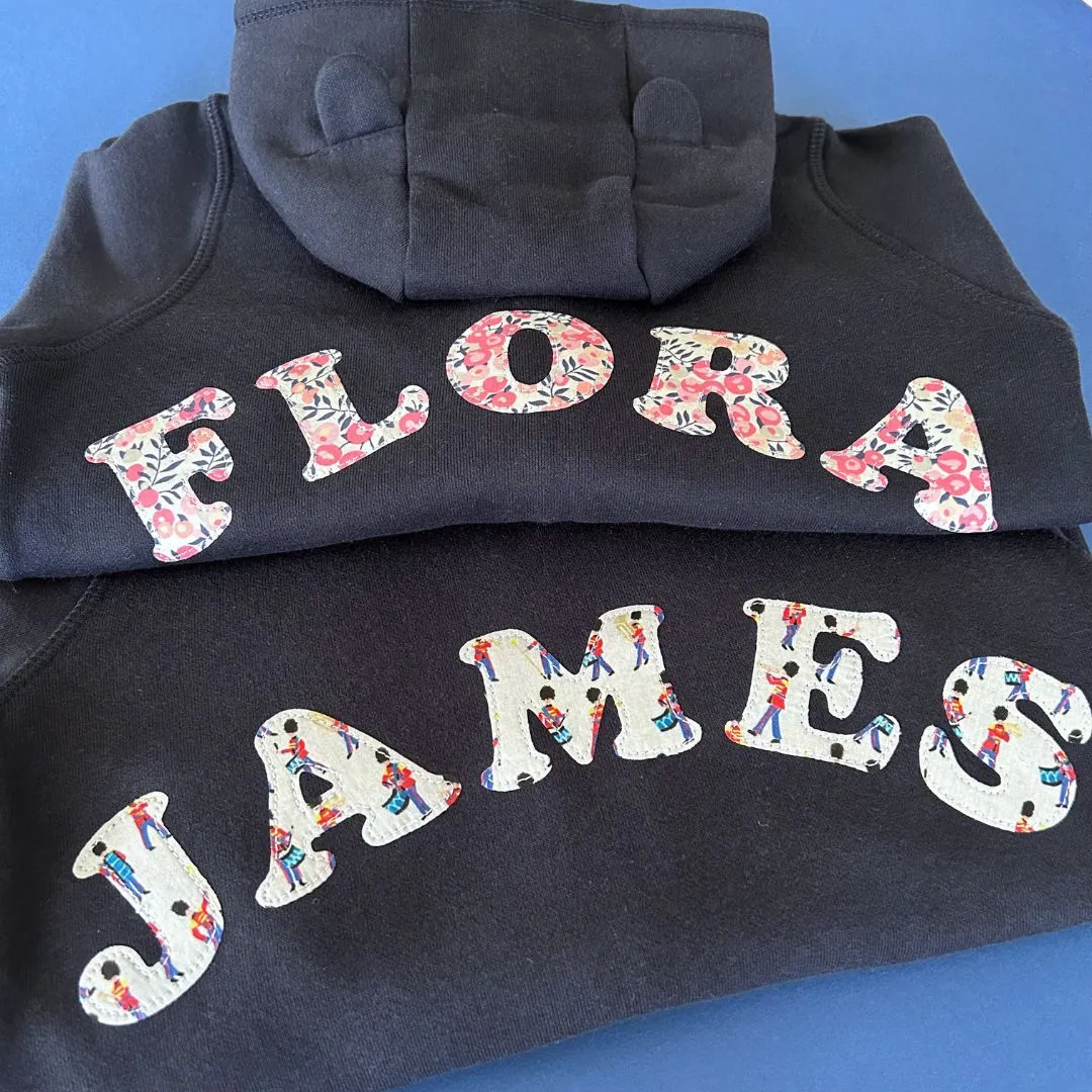 Name onesie with knee patches